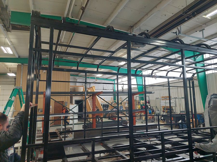 Powder-coated steel bus frame components