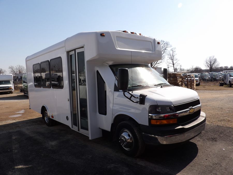 HLE 14-passenger shuttle bus with rear luggage compartment, passenger side