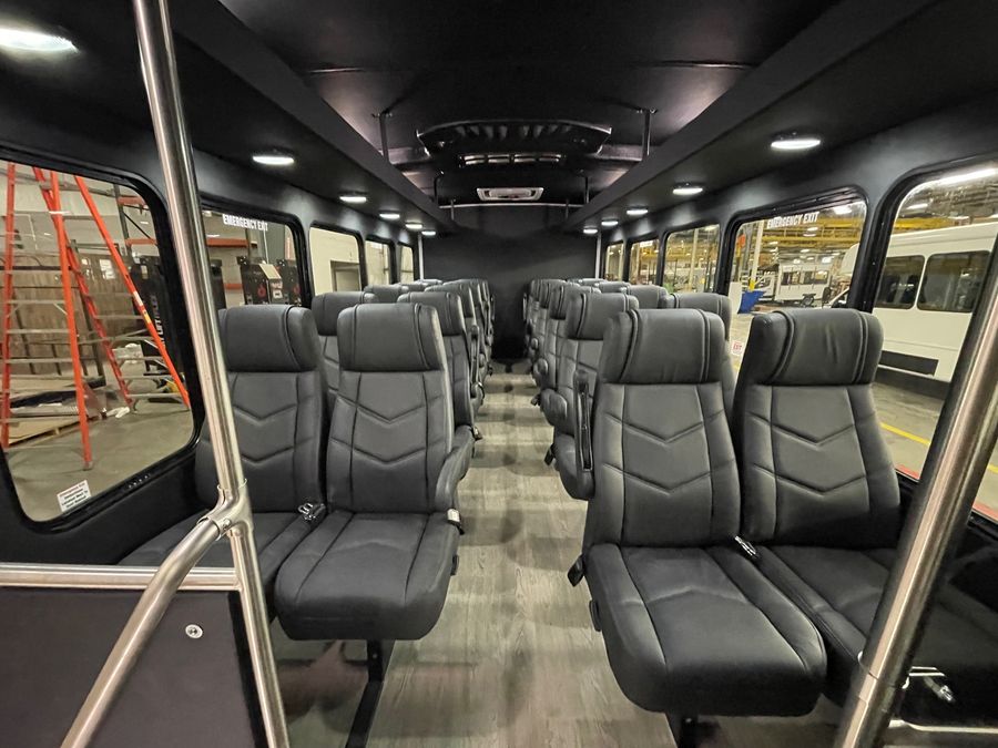 Premier high-back shuttle seating inside an HLE bus