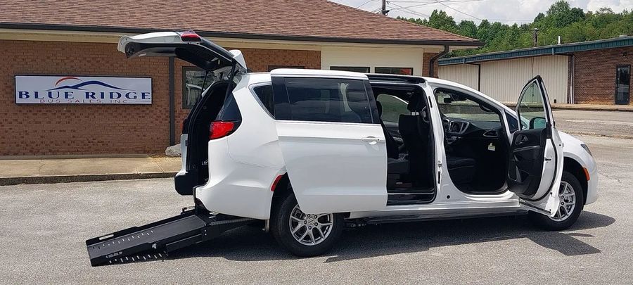 FR Conversions Chrysler minivan with rear-entry ramp deployed at the Blue Ridge lot