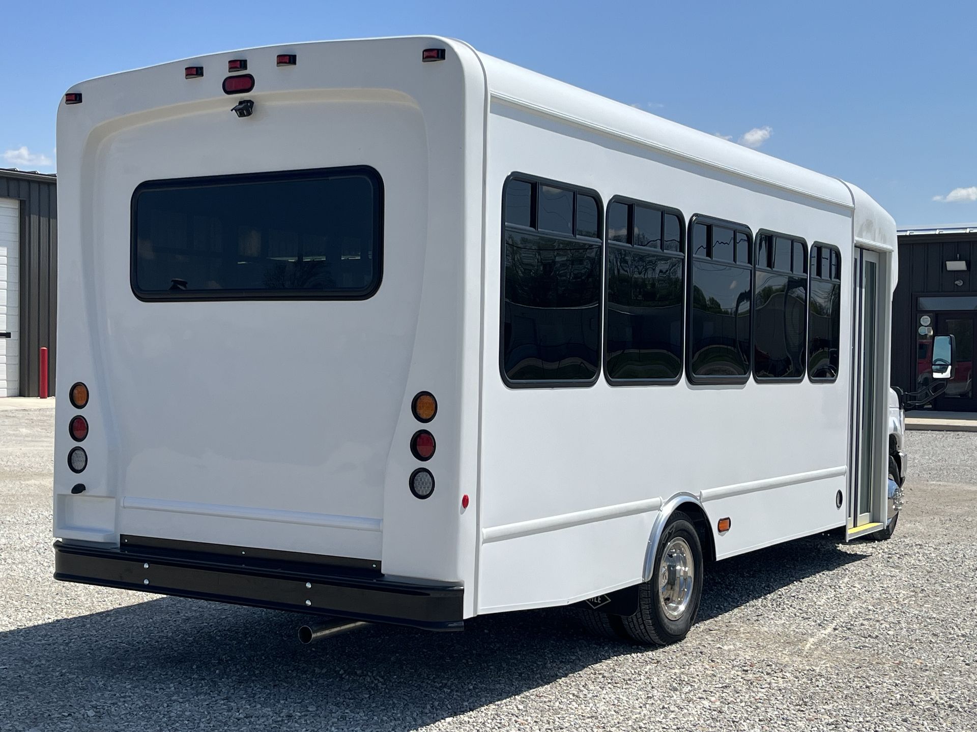 HLE shuttle bus exterior, rear three-quarter view in the sun