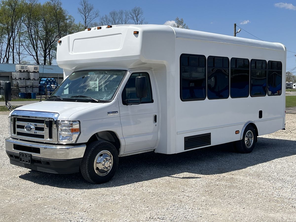 HLE Mavryk shuttle bus, exterior front three-quarter view in the sun