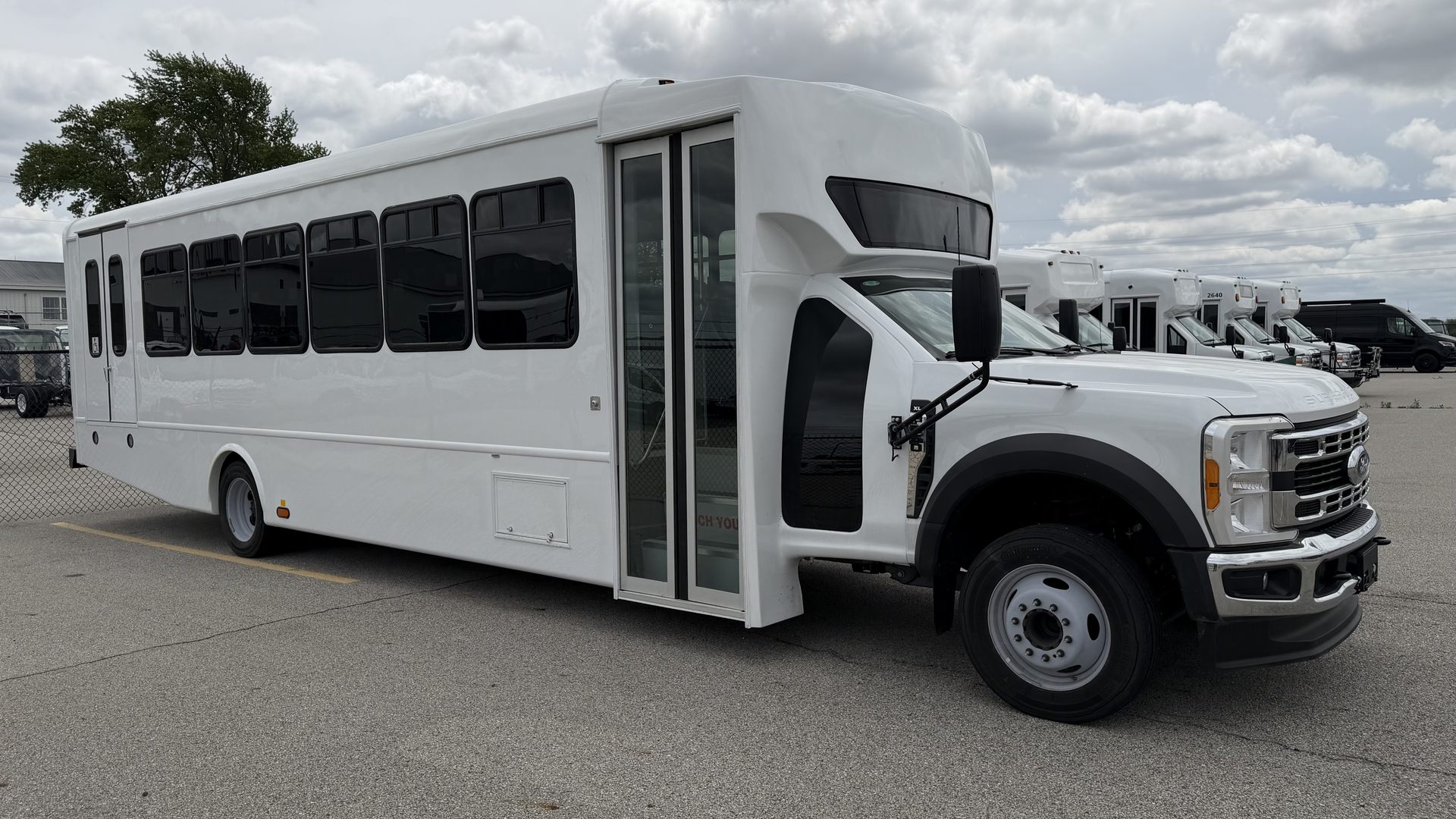HLE Kavlyr shuttle bus on the Ford F-550 chassis, front three-quarter view outdoors