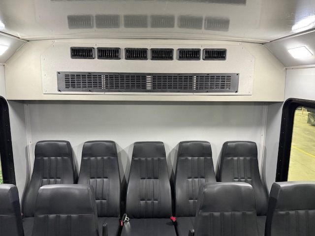 Kavlyr interior rear view with high-back seating and rear A/C