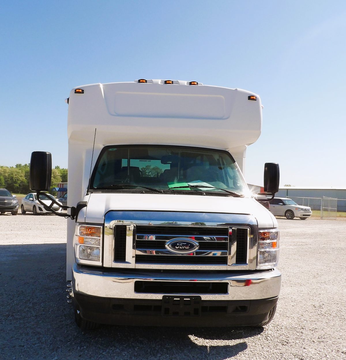 HLE Mavryk shuttle bus, front view under blue sky