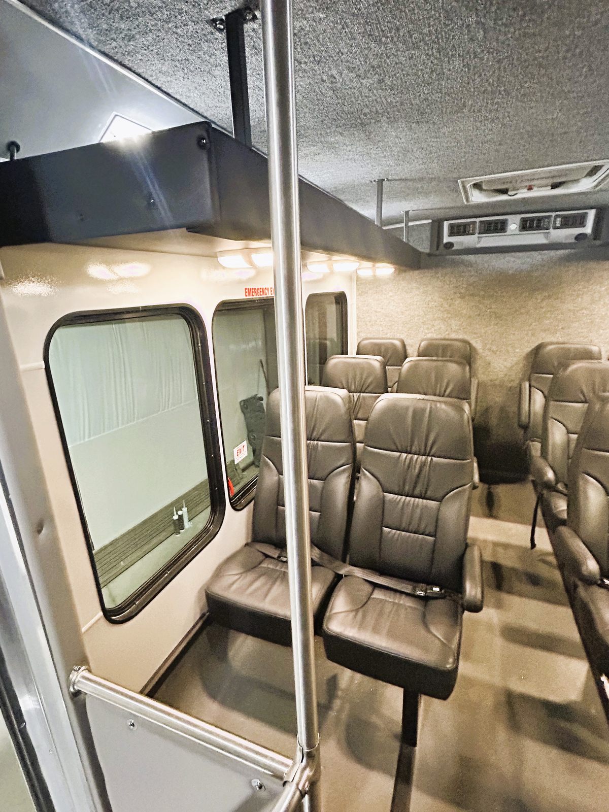 Mavryk 14-passenger interior with gray high-back seating