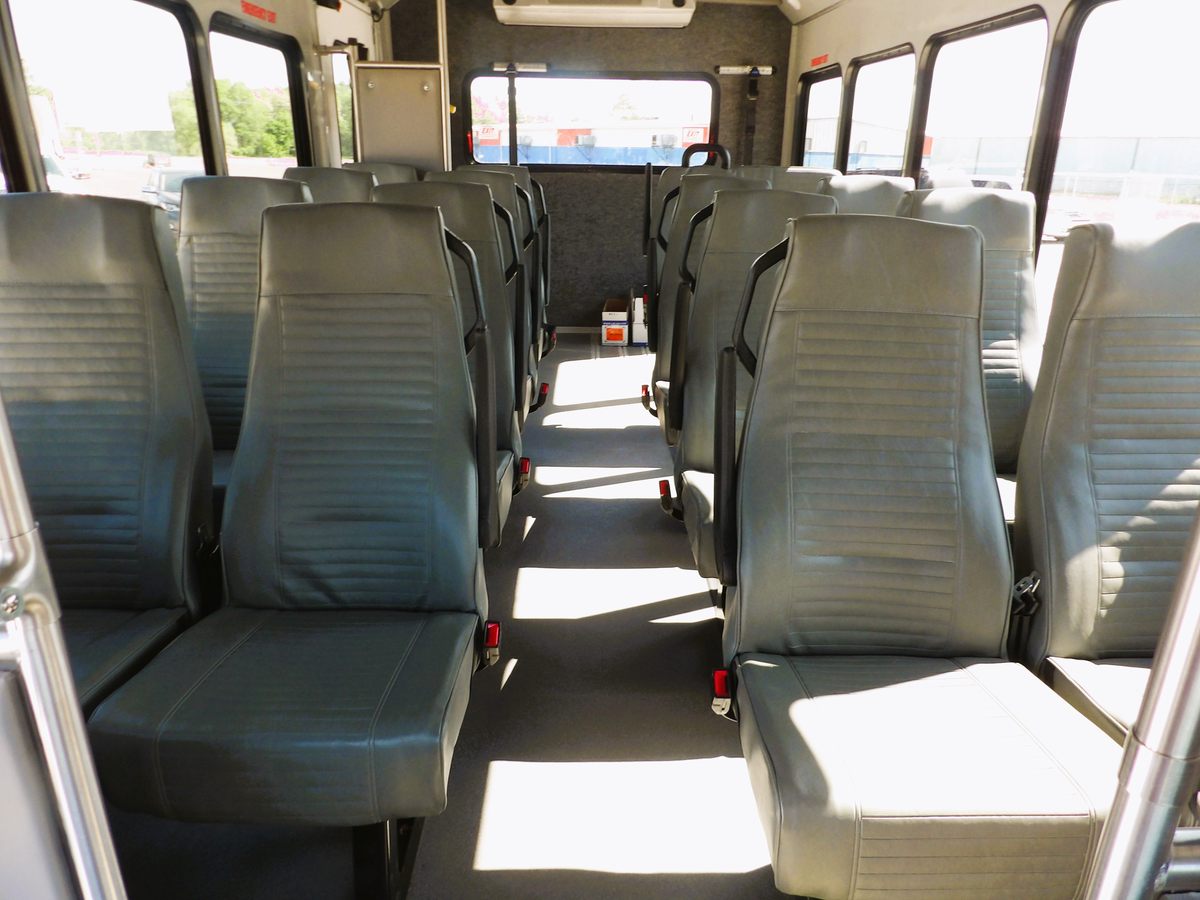 Mavryk 16+2 wheelchair interior with gray seating, front view
