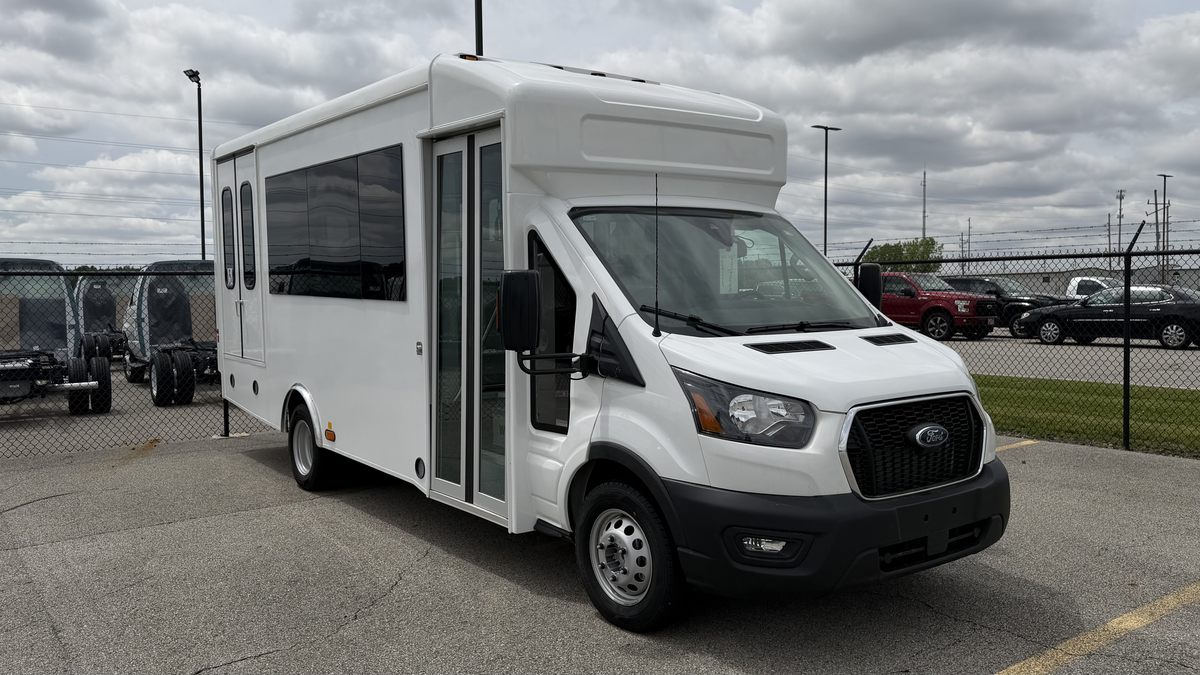 HLE Strykr Ford Transit shuttle, front view with entry door