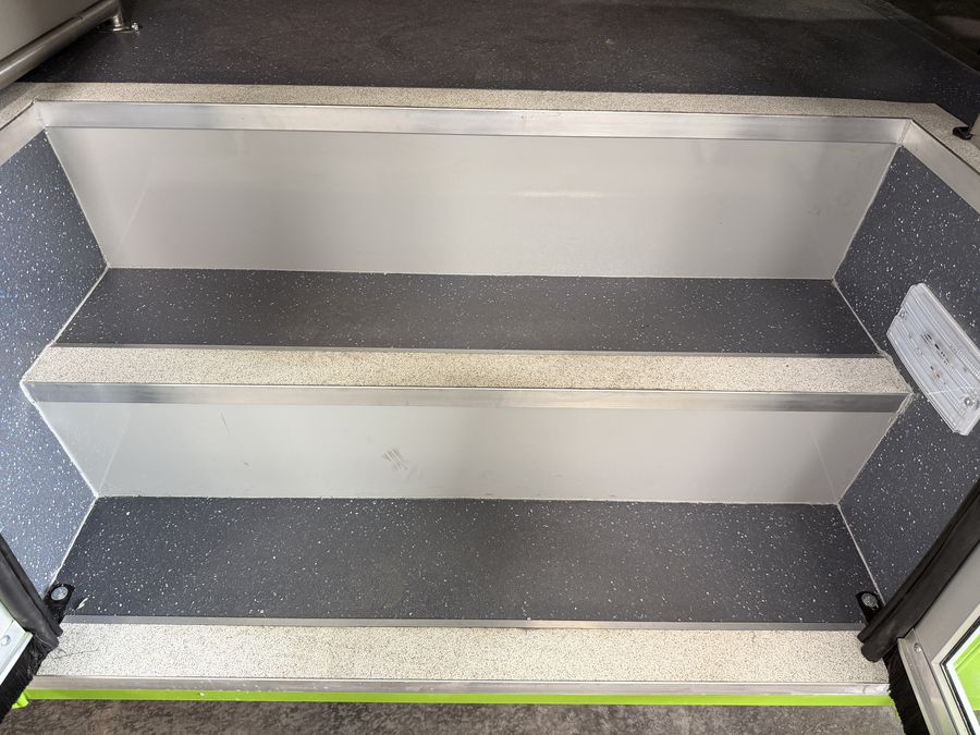 Entry steps and flooring taking shape inside a custom HLE build