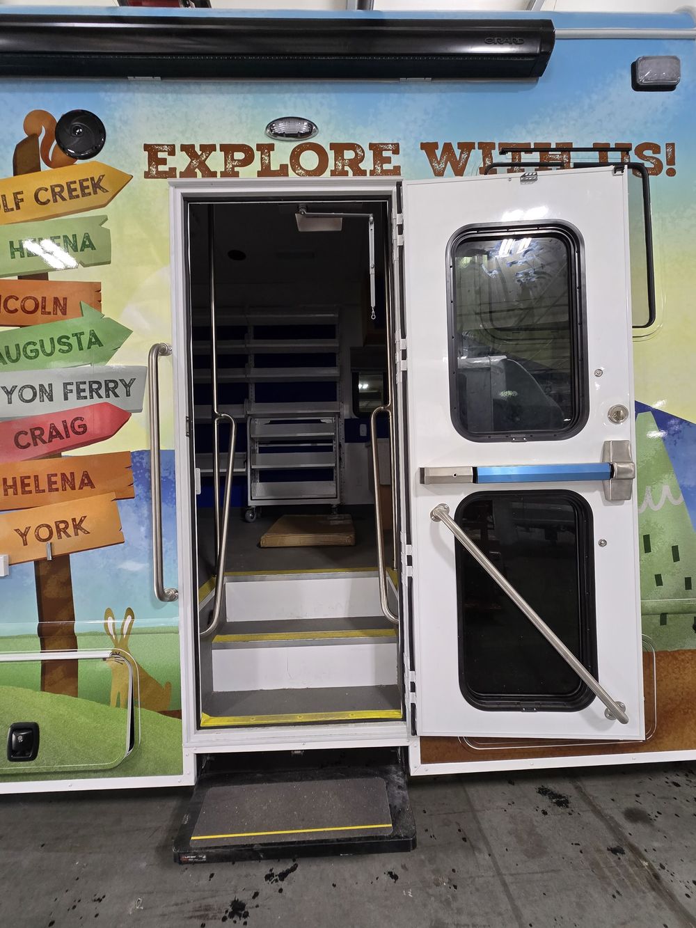 Rear entry of a wrapped mobile library outreach vehicle