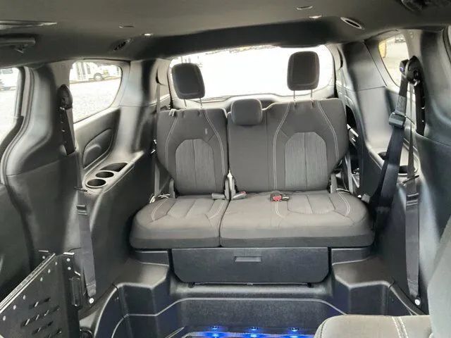 FR Conversions minivan interior with flip seating and open wheelchair position