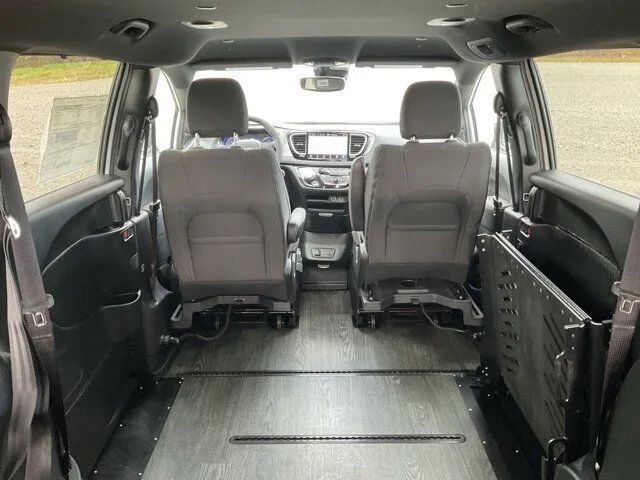 FR Conversions floor track system with seat and wheelchair mount points